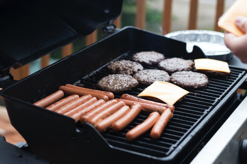 grill with hotdogs and burgers - photo by pam menegakis - unsplash